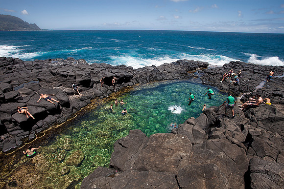 Jumping into Queen's Bath in Kauai by Christian Del Rosario